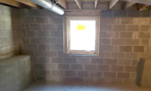Egress window in unfinished but brand new basement.